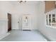 Light-filled bedroom with a vintage armoire, blue floors, and large window with a view at 95 Whitlock Sw Ave, Marietta, GA 30064