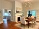 This dining room has a fireplace, french doors, and hardwood floors at 95 Whitlock Sw Ave, Marietta, GA 30064