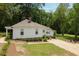 This well-maintained home features a landscaped yard, gravel driveway, and inviting curb appeal at 95 Whitlock Sw Ave, Marietta, GA 30064