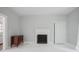 Bright living room with white floors, a charming fireplace, and period details at 95 Whitlock Sw Ave, Marietta, GA 30064