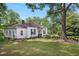 Well-maintained home with lush green lawn and mature trees at 95 Whitlock Sw Ave, Marietta, GA 30064