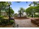 Picturesque town square featuring a fountain, benches, and lush greenery, inviting relaxation at 95 Whitlock Sw Ave, Marietta, GA 30064