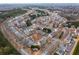 An aerial view showcases the density and community setting of the residential area at 1212 Lake Point Way, Suwanee, GA 30024
