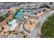 Aerial view of community with pool, tennis courts, and clubhouse at 1212 Lake Point Way, Suwanee, GA 30024