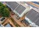 Aerial view of backyards with fenced in yards and decks at 1212 Lake Point Way, Suwanee, GA 30024