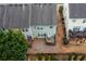 Aerial view of backyards with fenced in yards and wooden decks at 1212 Lake Point Way, Suwanee, GA 30024