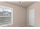 Bedroom with carpet, window and neutral color at 1212 Lake Point Way, Suwanee, GA 30024