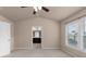 Bedroom featuring vaulted ceiling, carpeted flooring and entry to bathroom with dual vanity at 1212 Lake Point Way, Suwanee, GA 30024