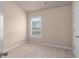 Bedroom with carpet, window and neutral color at 1212 Lake Point Way, Suwanee, GA 30024
