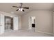 Large bedroom with vaulted ceilings, carpet, and two bathroom entrances at 1212 Lake Point Way, Suwanee, GA 30024