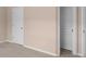 Bedroom with carpet, with access to closet and doors in neutral color at 1212 Lake Point Way, Suwanee, GA 30024