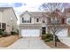 Inviting two-story home with a two-car garage and well-maintained landscaping at 1212 Lake Point Way, Suwanee, GA 30024