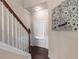Hallway featuring staircase, access to the backyard and natural light at 1212 Lake Point Way, Suwanee, GA 30024