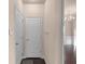 Hallway with hardwood floors featuring white molding and doors at 1212 Lake Point Way, Suwanee, GA 30024