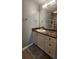 Well-lit bathroom features a large mirror, a white vanity, and a modern sink at 1250 Parkwood Cir # 2112, Atlanta, GA 30339