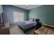 Comfortable bedroom with a ceiling fan, large window and a TV for relaxing evenings at 1250 Parkwood Cir # 2112, Atlanta, GA 30339