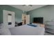 Well-lit bedroom featuring neutral decor, a large window, and closet, creating a serene atmosphere at 1250 Parkwood Cir # 2112, Atlanta, GA 30339