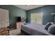 Cozy bedroom with a large window and ceiling fan providing a peaceful and relaxing space at 1250 Parkwood Cir # 2112, Atlanta, GA 30339