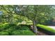 Parkwood Place entrance sign surrounded by lush green landscaping and mature trees at 1250 Parkwood Cir # 2112, Atlanta, GA 30339