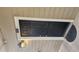 Front door entrance to unit with exterior light at 1250 Parkwood Cir # 2112, Atlanta, GA 30339