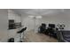 Open floor plan featuring a kitchen with a breakfast bar next to an office with space for two desks at 1250 Parkwood Cir # 2112, Atlanta, GA 30339