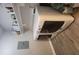 Bright laundry area includes stacked washer/dryer and ample shelving for storage at 1250 Parkwood Cir # 2112, Atlanta, GA 30339
