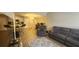 Open concept living room and kitchen with modern lighting and comfortable seating arrangement at 1250 Parkwood Cir # 2112, Atlanta, GA 30339