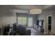 Comfortable living room with lots of natural light, a ceiling fan, and access to a patio or balcony at 1250 Parkwood Cir # 2112, Atlanta, GA 30339