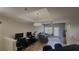 Open concept living space with wood flooring, modern lighting, and comfortable furniture arrangement at 1250 Parkwood Cir # 2112, Atlanta, GA 30339