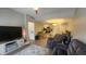 Spacious living room area with kitchen in the background and lots of natural light at 1250 Parkwood Cir # 2112, Atlanta, GA 30339
