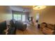 Comfortable living room with natural light, leading to balcony, and adjacent to the bedroom at 1250 Parkwood Cir # 2112, Atlanta, GA 30339