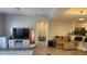 Open living space featuring a TV, modern decor, and a view to the kitchen and dining area at 1250 Parkwood Cir # 2112, Atlanta, GA 30339