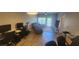 Bright living room with hardwood floors, comfortable seating, and a view to the balcony at 1250 Parkwood Cir # 2112, Atlanta, GA 30339