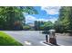 View of community building, trees, and parking lot at 1250 Parkwood Cir # 2112, Atlanta, GA 30339