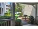 A cozy outdoor patio space with potted plants and grill overlooking lush greenery at 1250 Parkwood Cir # 2112, Atlanta, GA 30339