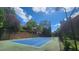 Community tennis court with lush green trees at 1250 Parkwood Cir # 2112, Atlanta, GA 30339