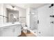 Modern bathroom featuring a white vanity, toilet, and glass-enclosed shower at 219 Phillips Ln, Alpharetta, GA 30009