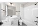 Bathroom featuring a tub, a modern shower head, and a white vanity at 219 Phillips Ln, Alpharetta, GA 30009