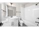 Bathroom featuring modern vanity, tub, shower and white subway tile at 219 Phillips Ln, Alpharetta, GA 30009