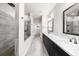 Modern bathroom featuring double vanity, spacious shower, and gray tile flooring at 219 Phillips Ln, Alpharetta, GA 30009