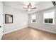 Bright bedroom with a ceiling fan, and two windows, offering light-filled space at 219 Phillips Ln, Alpharetta, GA 30009