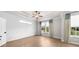 Spacious bedroom with tray ceiling, ample light, and shiplap accent wall at 219 Phillips Ln, Alpharetta, GA 30009