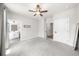 Bedroom with neutral carpet, open entry into bathroom, and natural light at 219 Phillips Ln, Alpharetta, GA 30009