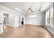 Spacious bedroom featuring hardwood floors, tray ceiling, and ample natural light from the many windows at 219 Phillips Ln, Alpharetta, GA 30009