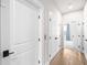 Bright hallway with hardwood floors, multiple doors, and an elevator at 219 Phillips Ln, Alpharetta, GA 30009