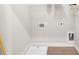 White laundry room with utility sink and washer dryer hookups at 219 Phillips Ln, Alpharetta, GA 30009