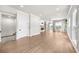 Spacious living room featuring hardwood floors, recessed lighting, large windows, and a cozy fireplace at 219 Phillips Ln, Alpharetta, GA 30009