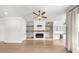 Spacious living room with fireplace and open shelving at 219 Phillips Ln, Alpharetta, GA 30009
