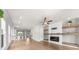 Bright and spacious living room features a modern fireplace and hardwood floors at 219 Phillips Ln, Alpharetta, GA 30009