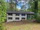 Two story exterior home with black shutters and lush surrounding landscaping providing curb appeal at 2851 Headland Dr, East Point, GA 30344
